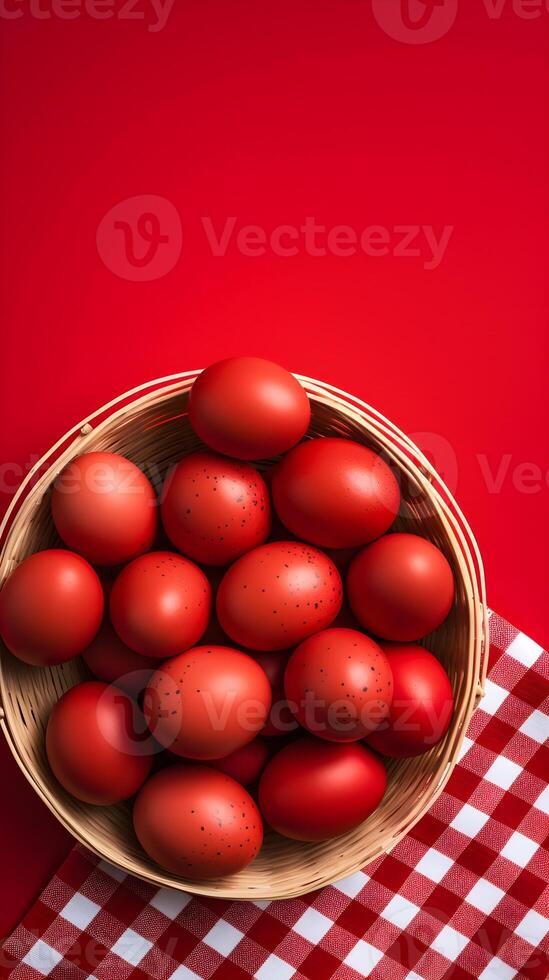 A basket of colorful eggs with copyspace on a red background. Easter egg concept, Spring holiday photo