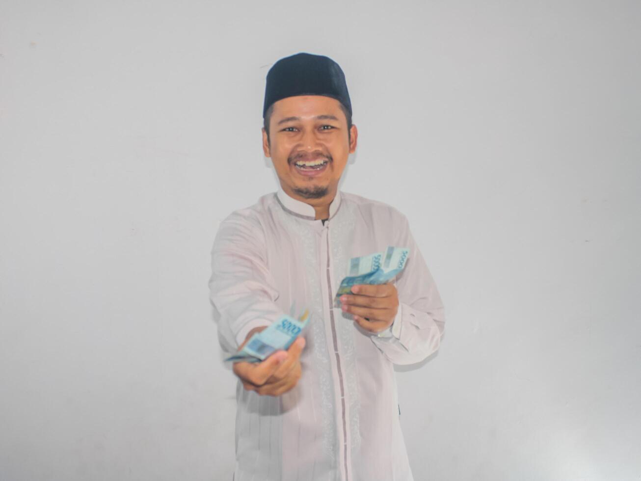 Asian moslem man donate his money photo