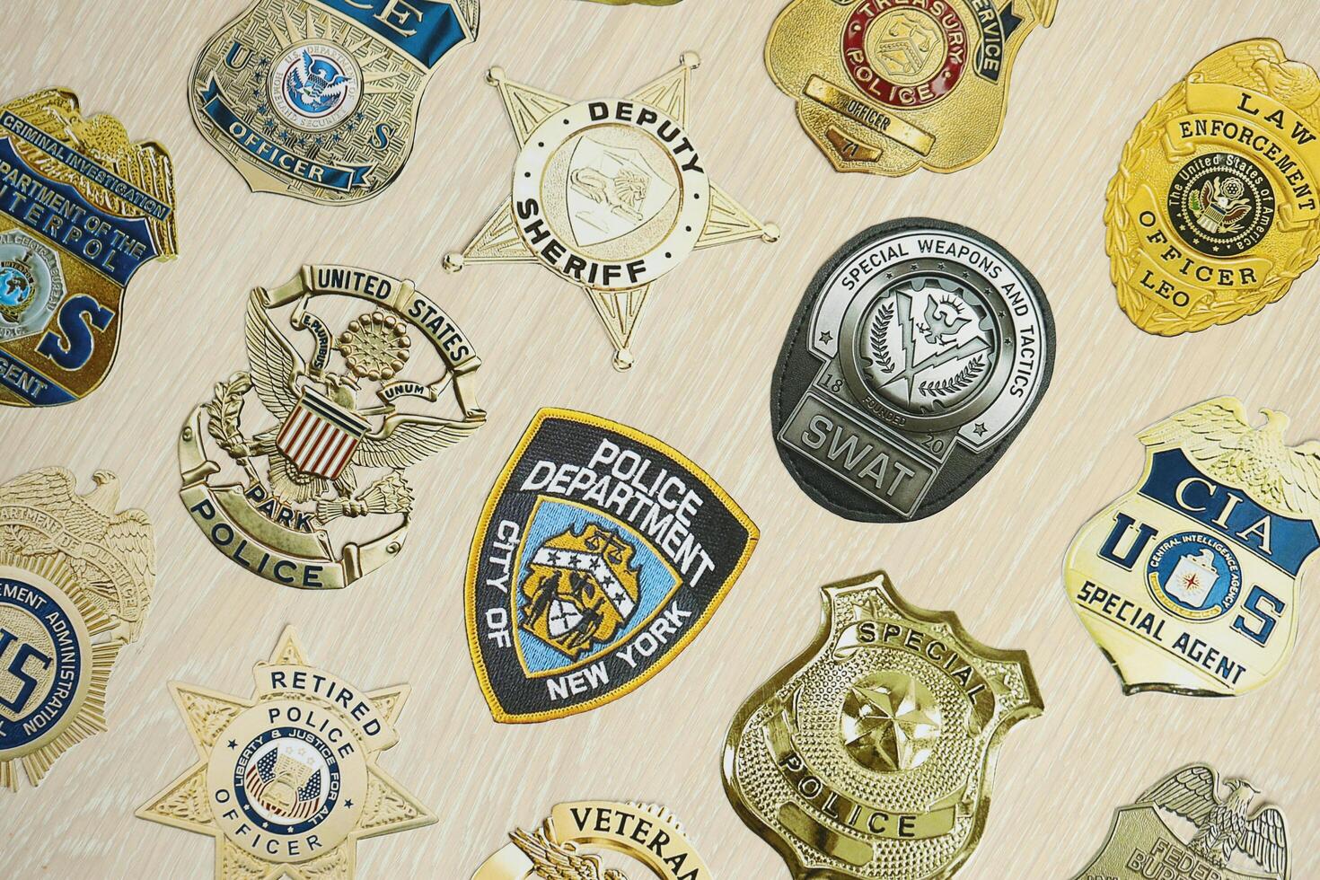 KYIV, UKRAINE - MARCH 9, 2024 Badges of different United States police departments printed on paper photo