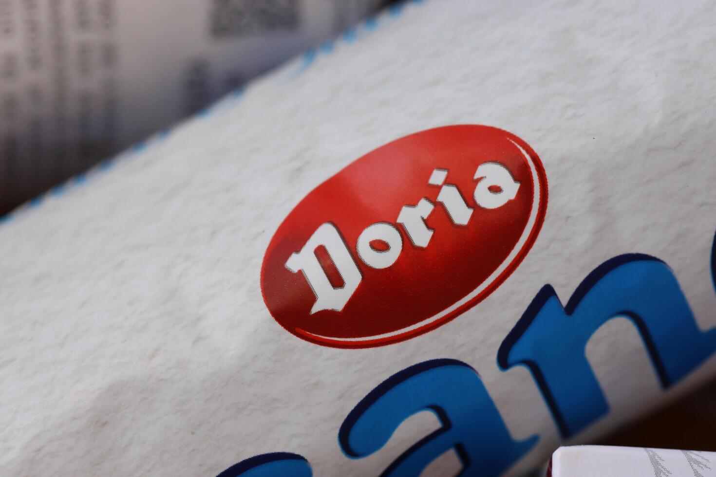 KYIV, UKRAINE - 4 MAY, 2023 Doria logo on cardboard pack of italian food photo