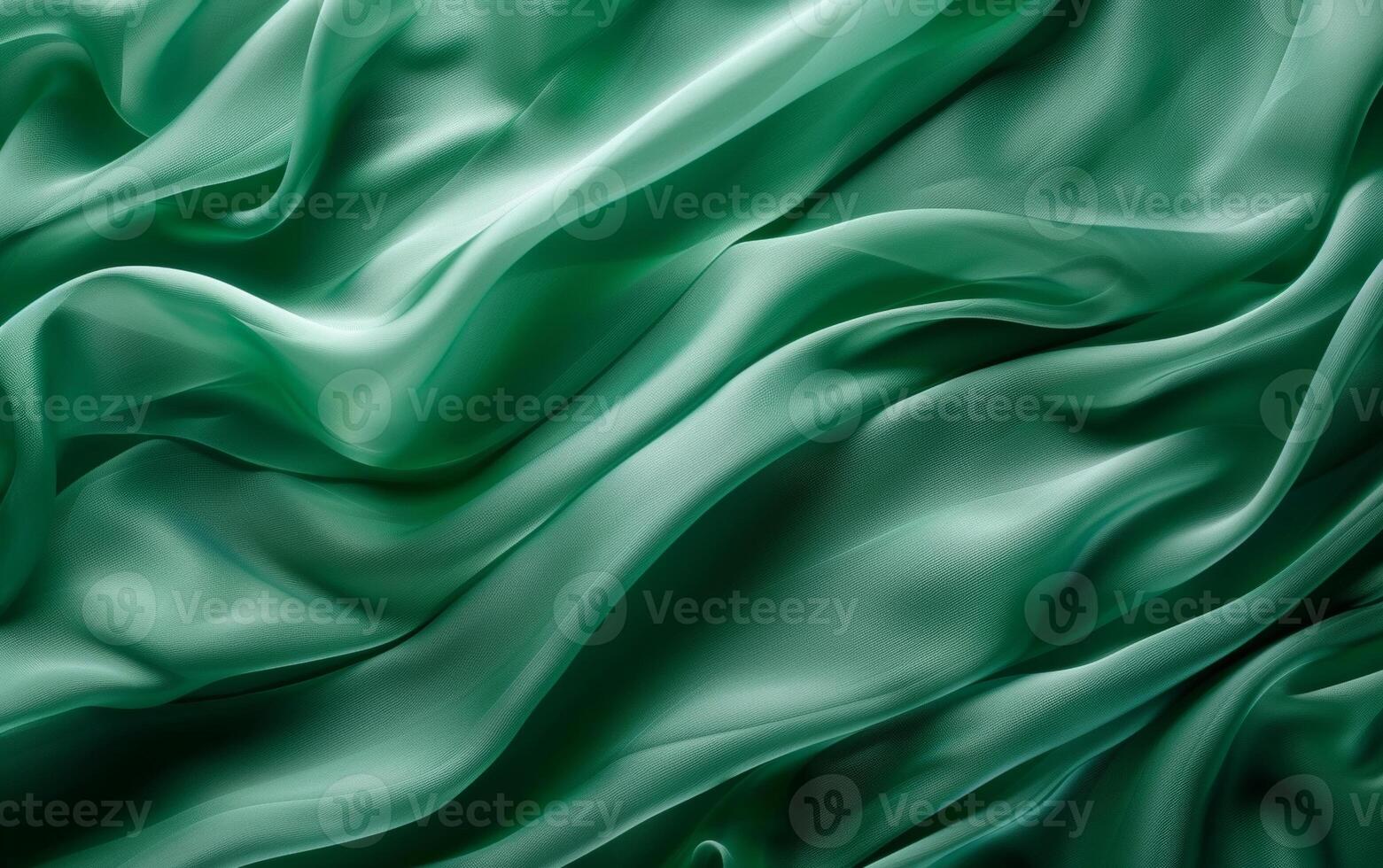 Lush folds of luxurious emerald green satin fabric draping sensually, highlighting the rich texture and elegant sheen. photo