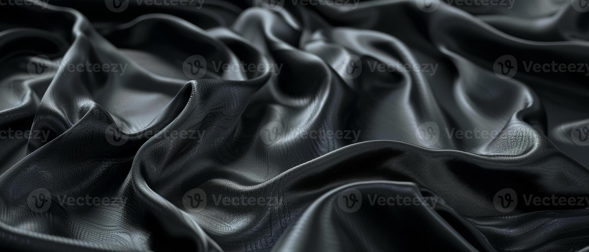 Rich folds of jet black satin draped sensuously, revealing the sultry sheen and fluid drape of the high-quality fabric. photo