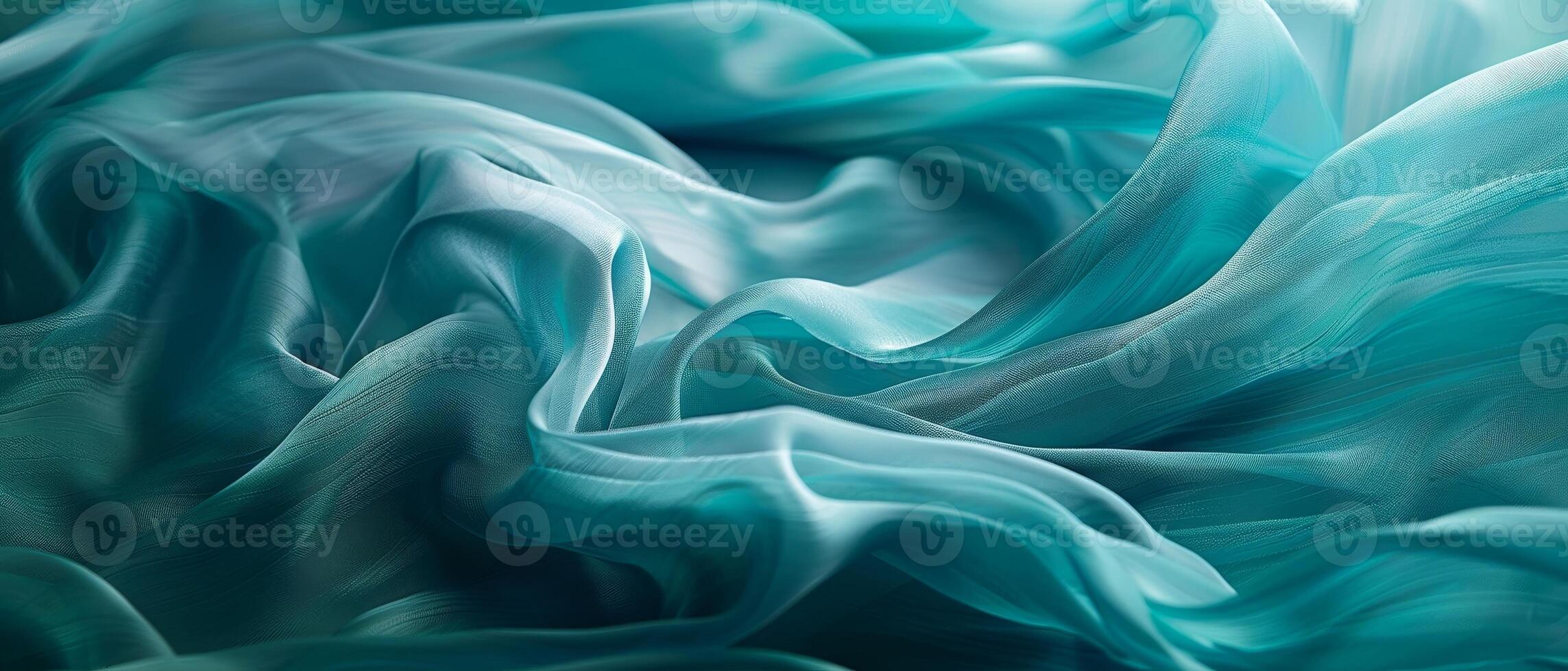 Airy folds of pale aquamarine satin fabric billowing gracefully, revealing the delicate sheen and featherlight quality. photo