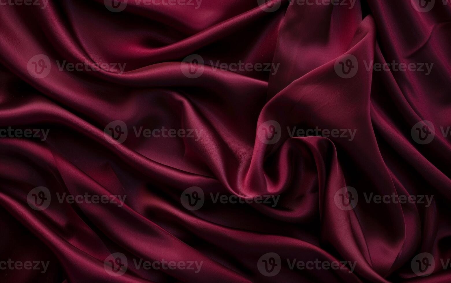 Passionate waves of deep red satin cascade in rich folds, offering a sensual and vibrant display of luxurious fabric texture. photo