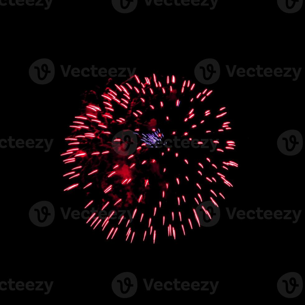 Colorful celebration fireworks isolated on black sky background. photo