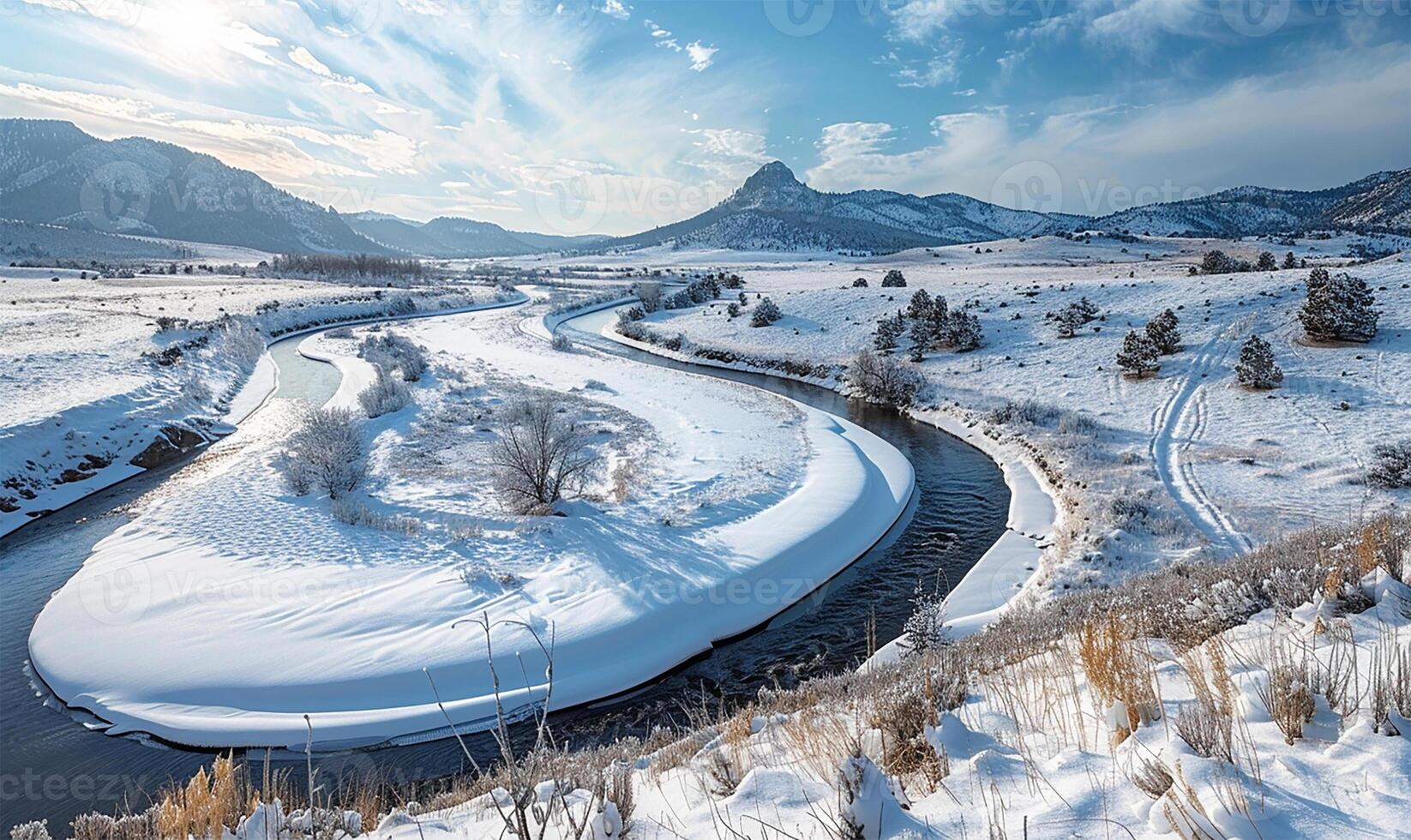 Winter wonderland, a river flowing amidst snow-covered peaks photo