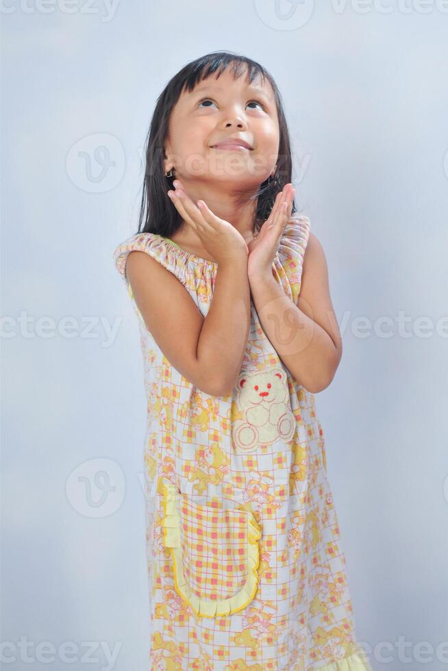 an Indonesian little girl with curiousity pose photo