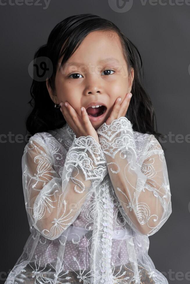 A Young Asian girl wearing Javanese Traditional Clothes photo