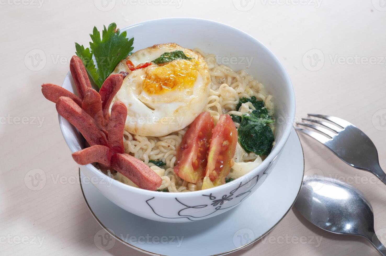 Mie Instant Sosis Telur or Instant Noodle with Sausage and Fried Egg photo