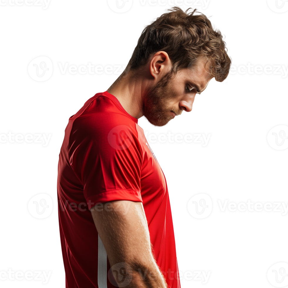 Male athlete in red t-shirt stands sadly with his head bowed. png