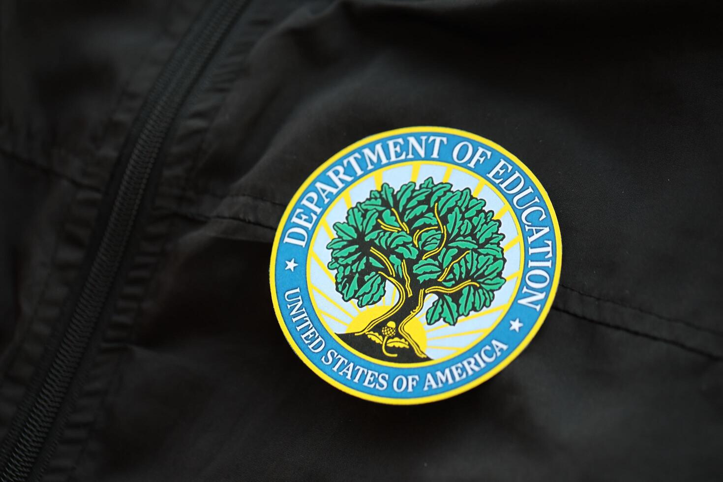 KYIV, UKRAINE - MARCH 9, 2024 US Department of Education seal on black jacket uniform photo