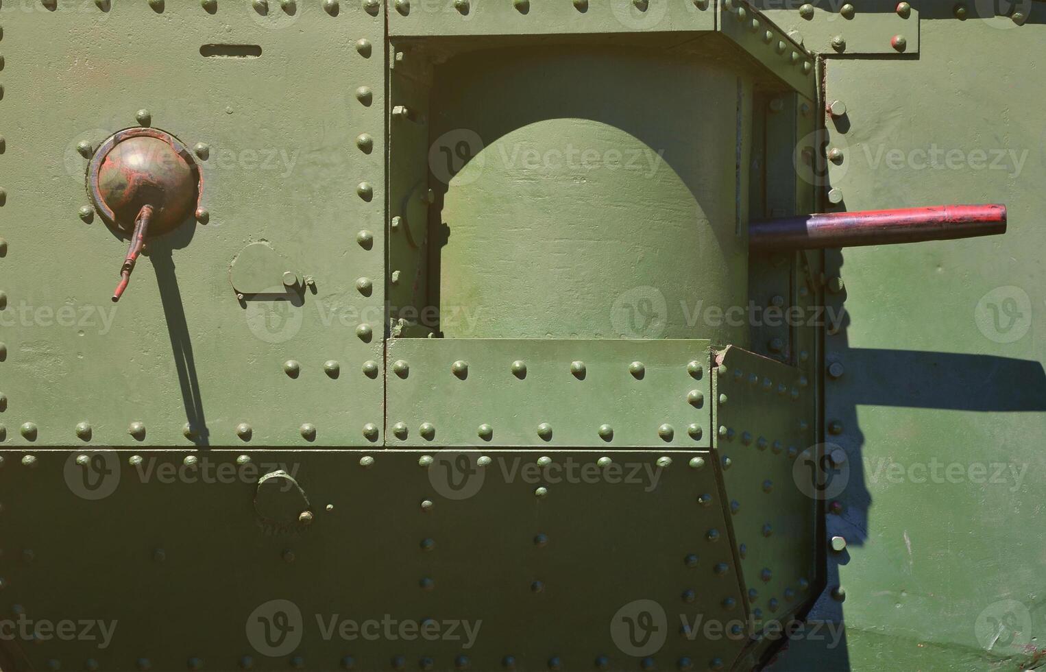 The texture of the wall of the tank, made of metal and reinforced with a multitude of bolts and rivets. Images of the covering of a combat vehicle from the Second World War with a guided machine gun photo