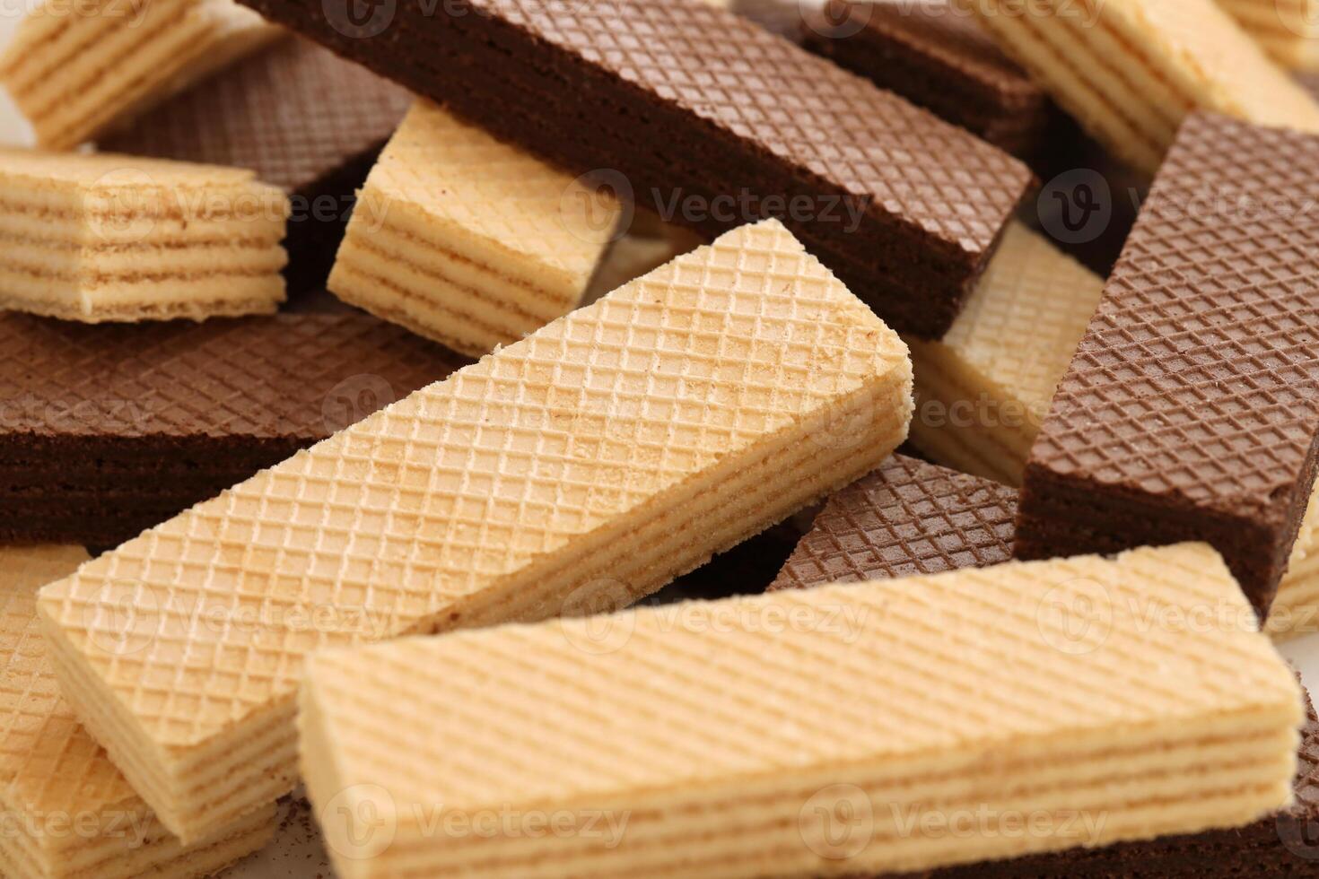 Stacked delicious chocolate wafers in large amount. Two different flavours of classic waffles photo