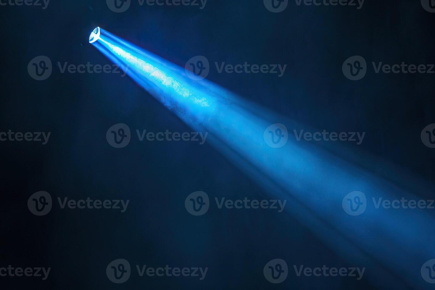 AI generated blue spotlight light beam on black background photo
