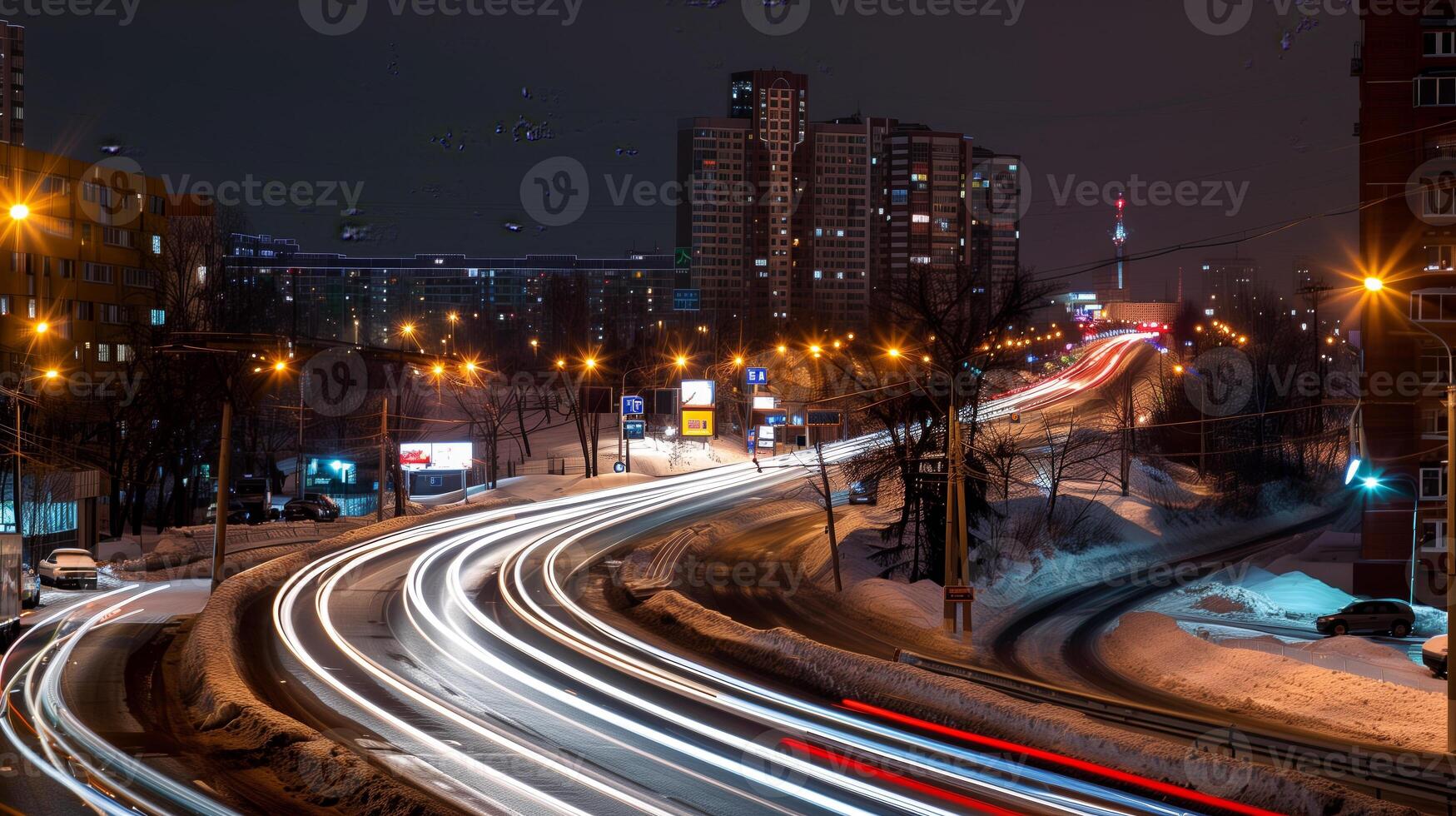 Streaks of moving car lights against the backdrop of city lights at night photo