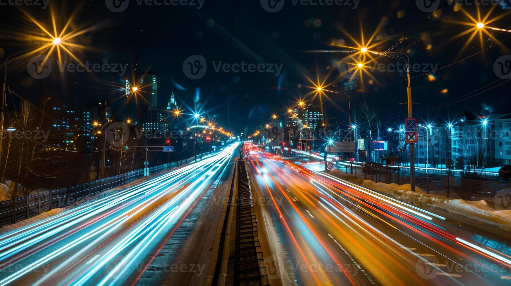 Streaks of moving car lights against the backdrop of city lights at night photo