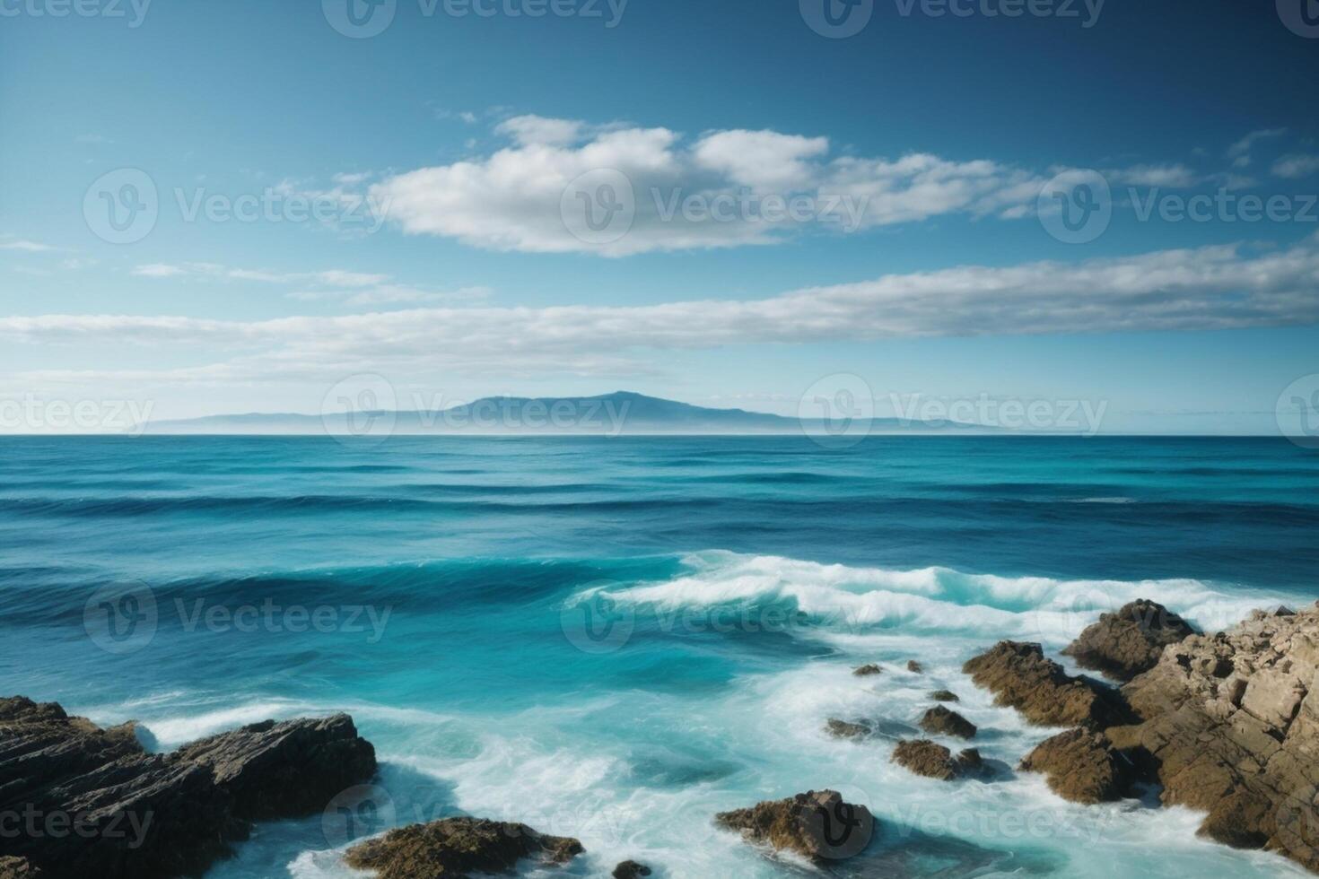 a beautiful blue ocean with waves and clouds photo