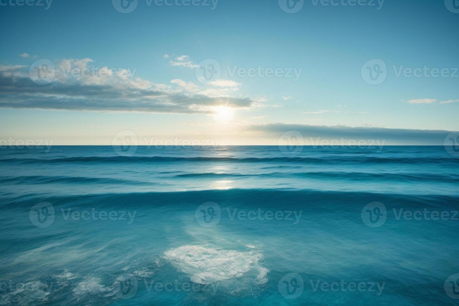 blue ocean with mountains and clouds photo