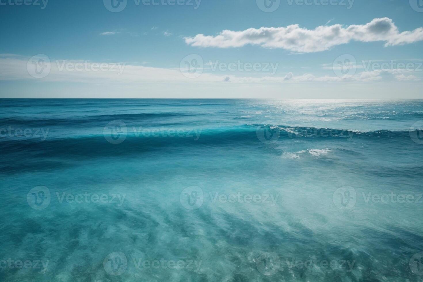 blue ocean with clouds and sun in the sky photo