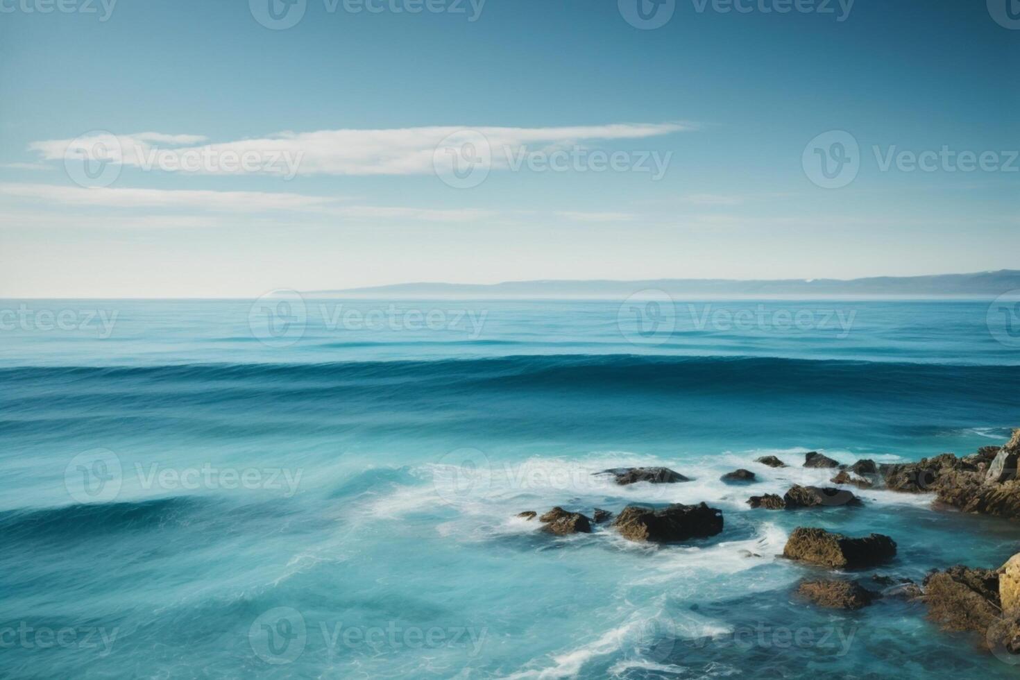 a beautiful beach with waves and blue sky photo