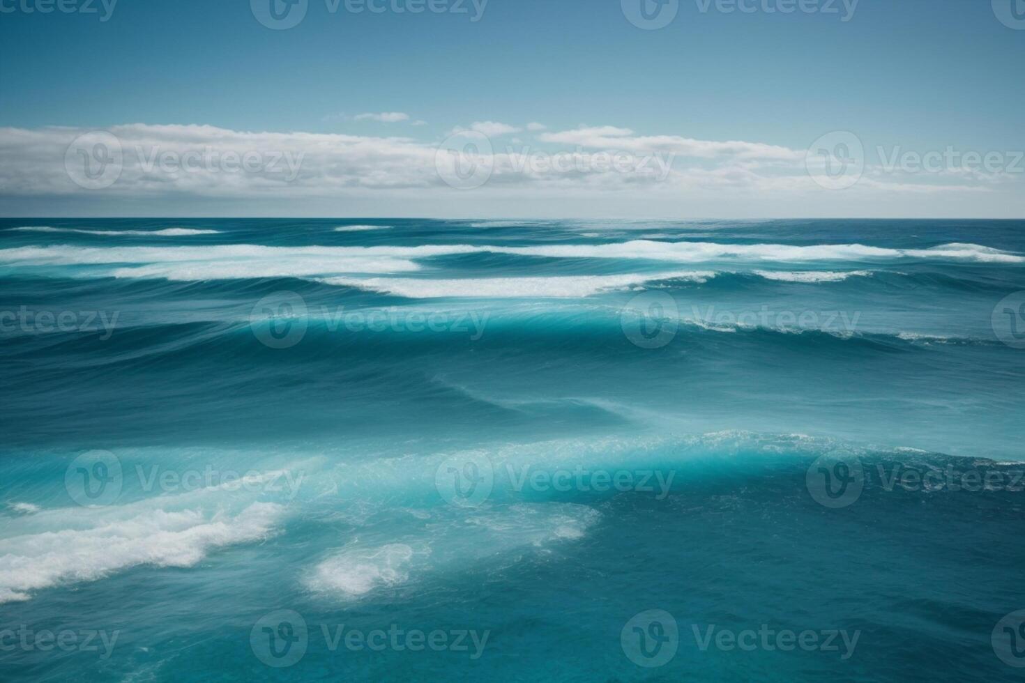 a beautiful beach with waves and blue sky photo