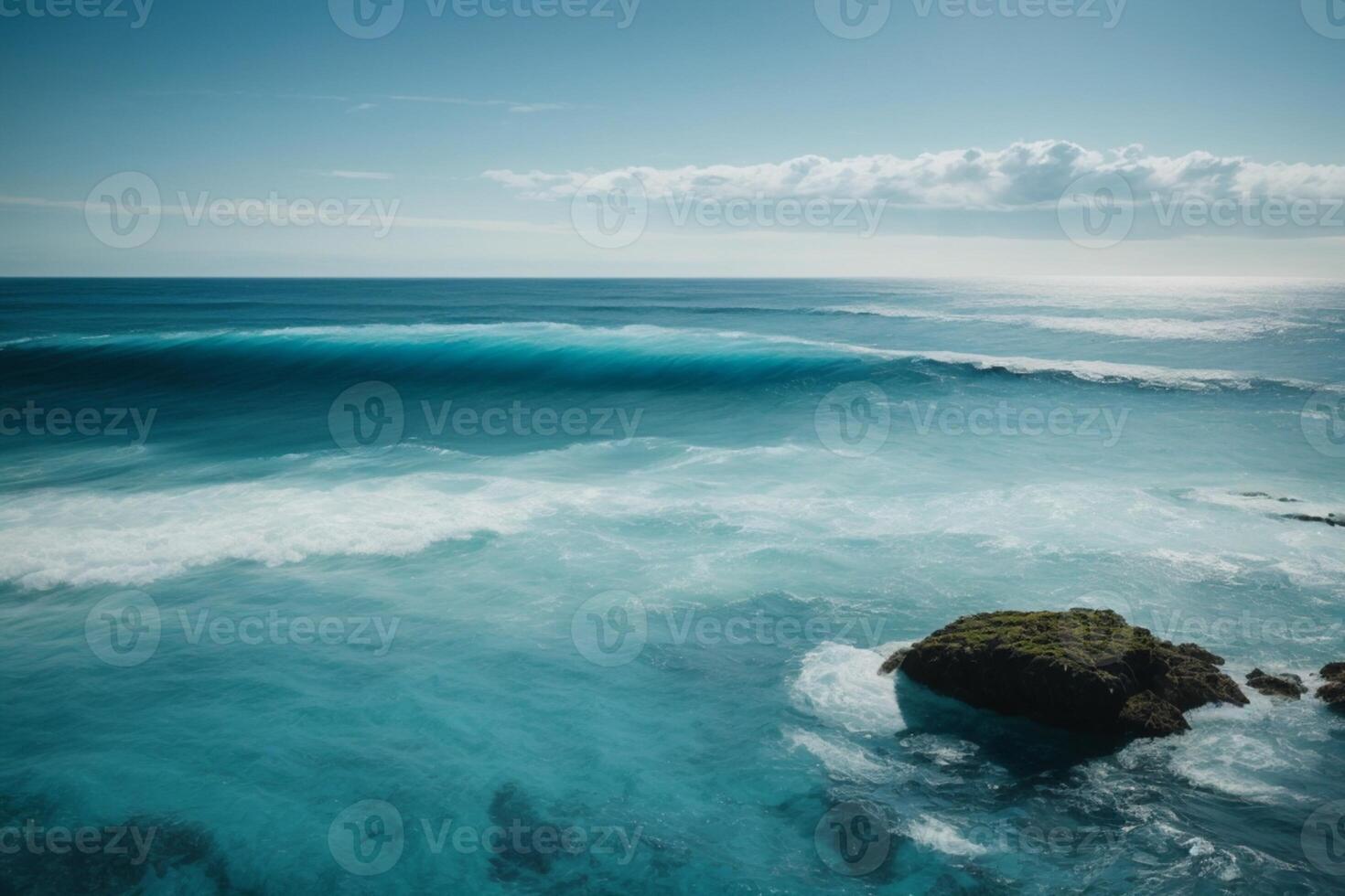 a beautiful beach with waves and blue sky photo