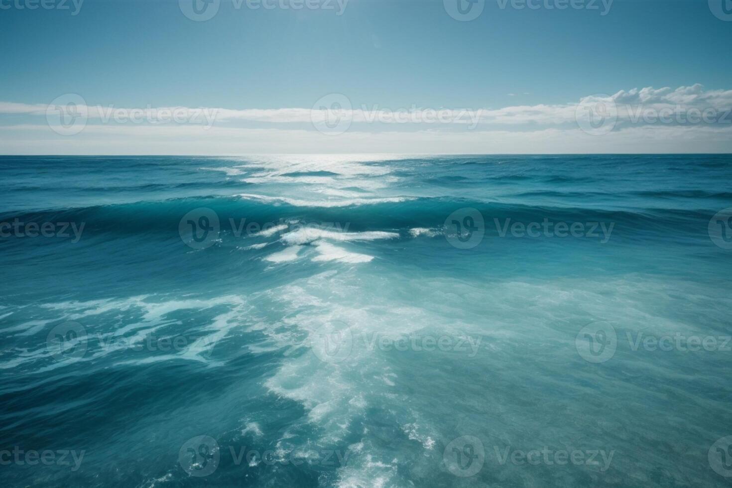 a beautiful beach with waves and blue sky photo