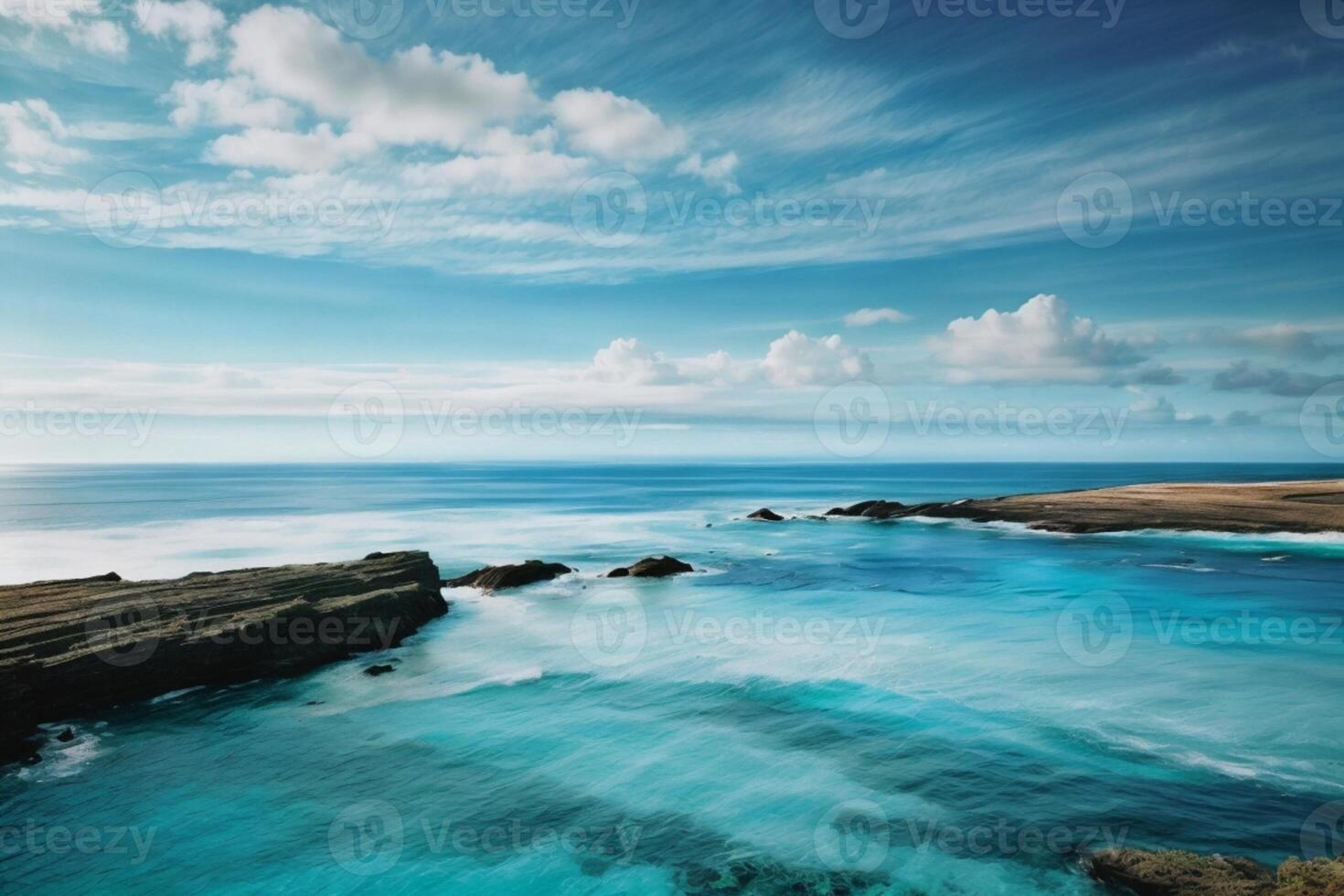 a beautiful beach with waves and blue sky photo