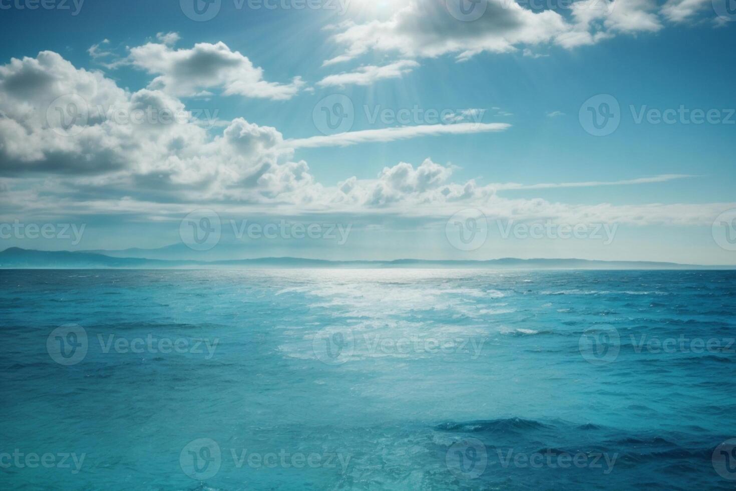 blue ocean waves and sun rays in the ocean photo