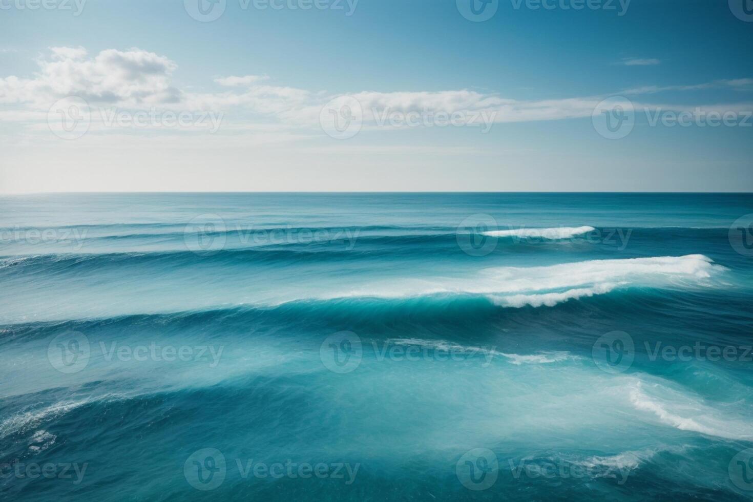 blue ocean waves and sun rays in the ocean photo