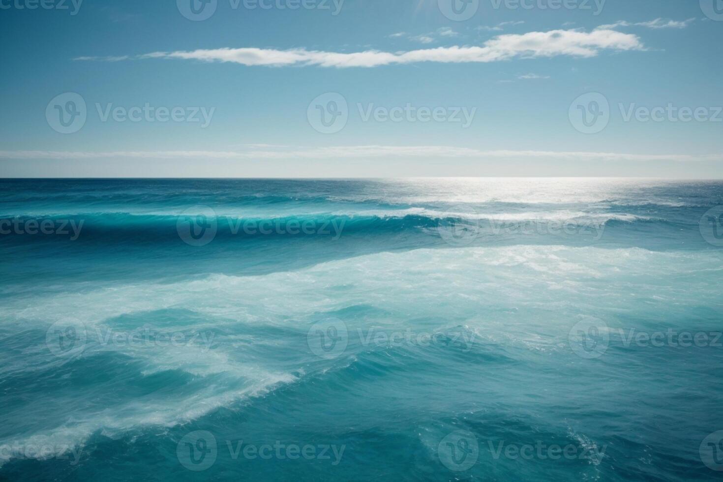 blue ocean waves and sun rays in the ocean photo