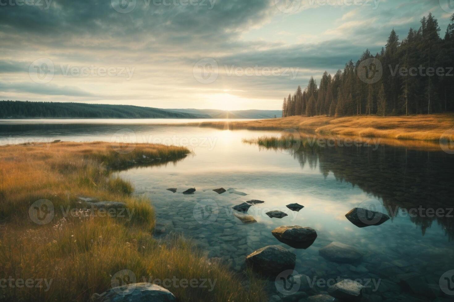 a mountain range is reflected in the water at sunset photo