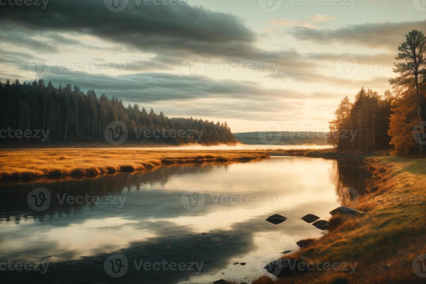 a lake surrounded by trees and a cloudy sky photo