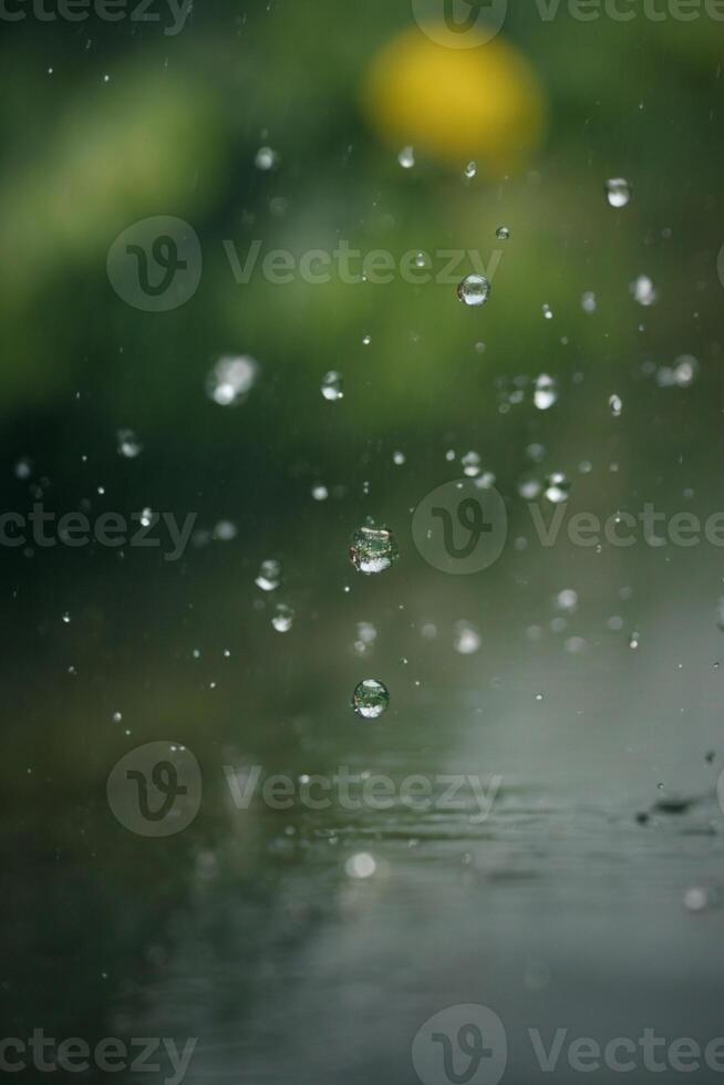 raindrops on a street in the city at night photo