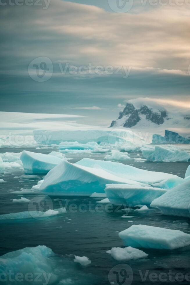 icebergs floating in the water with a sunset photo