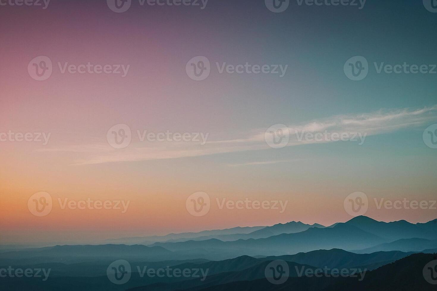 a mountain range with a sunset in the background photo