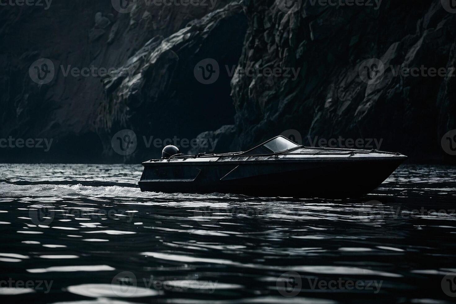 a black boat is floating in the water photo