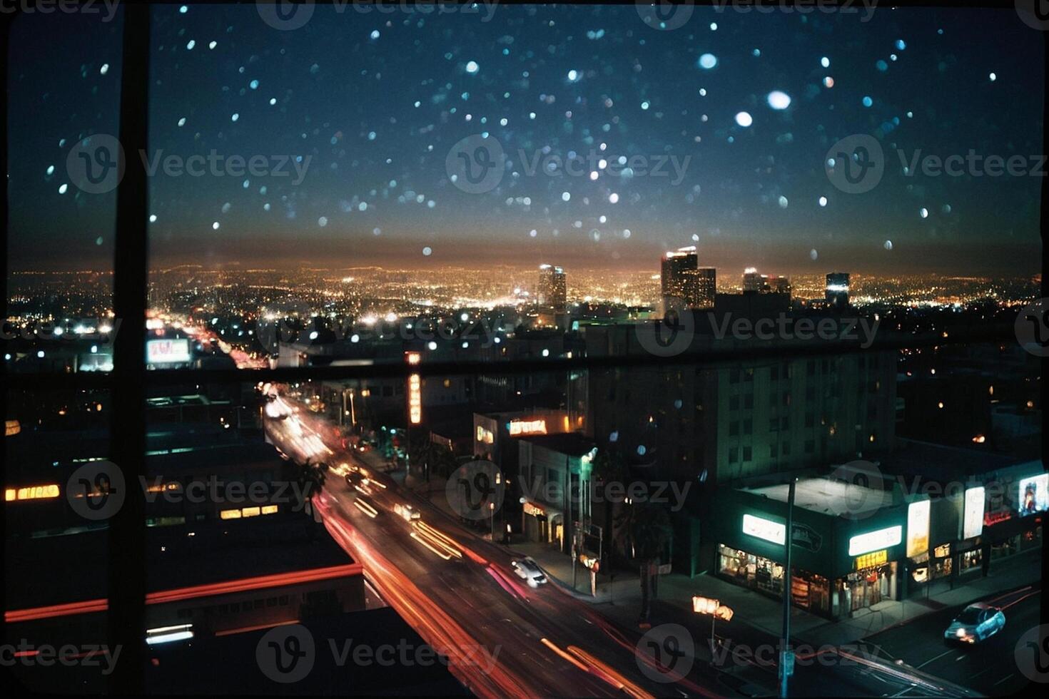 a view of the city from a window at night photo