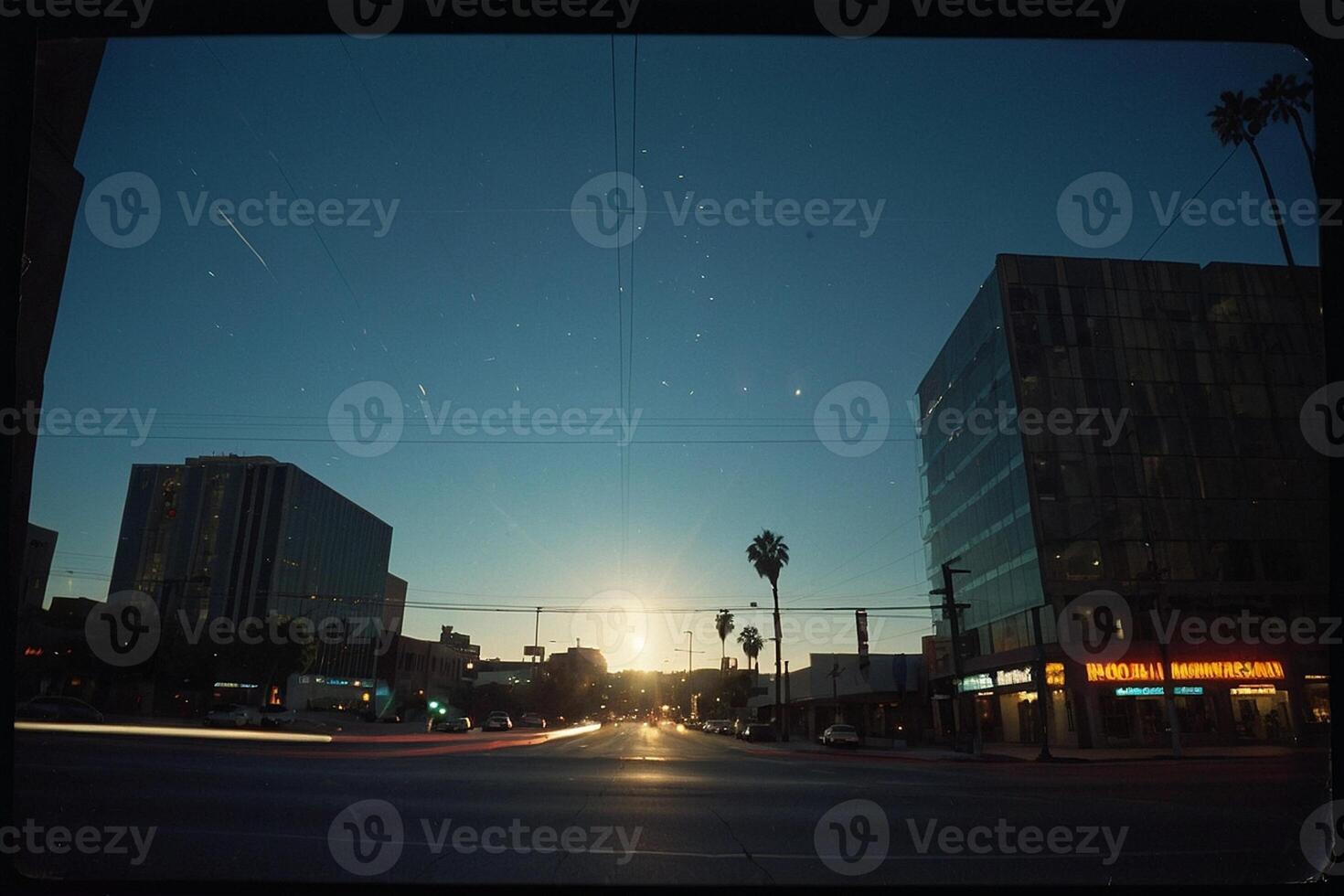 a view of the sunset from a street in downtown los angeles photo