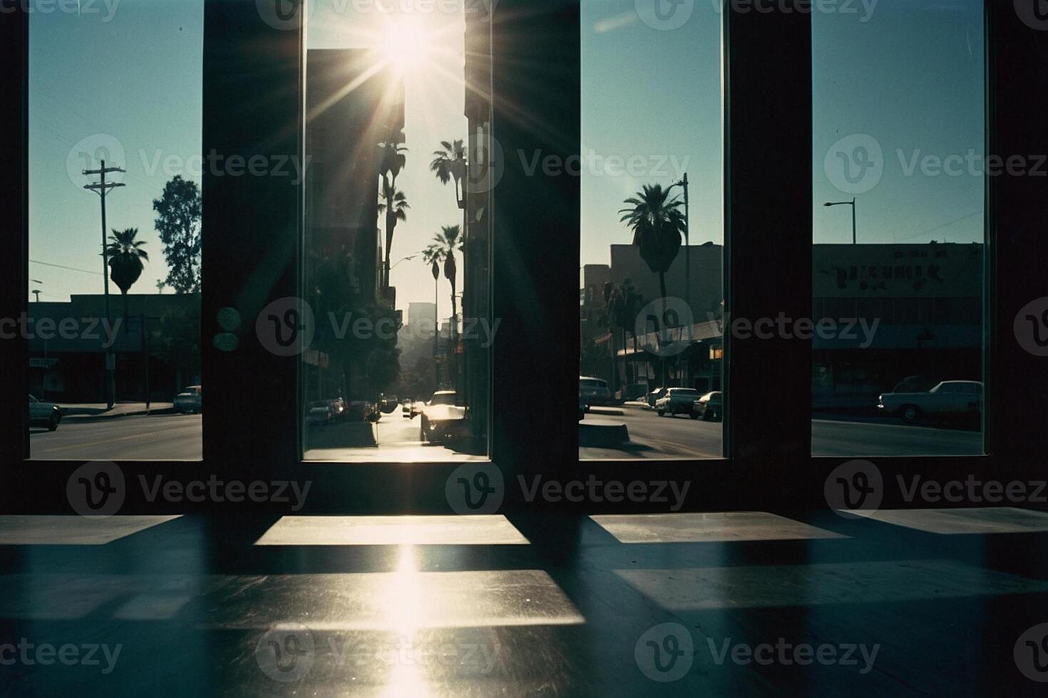 a view of the sun shining through the windows of a building photo