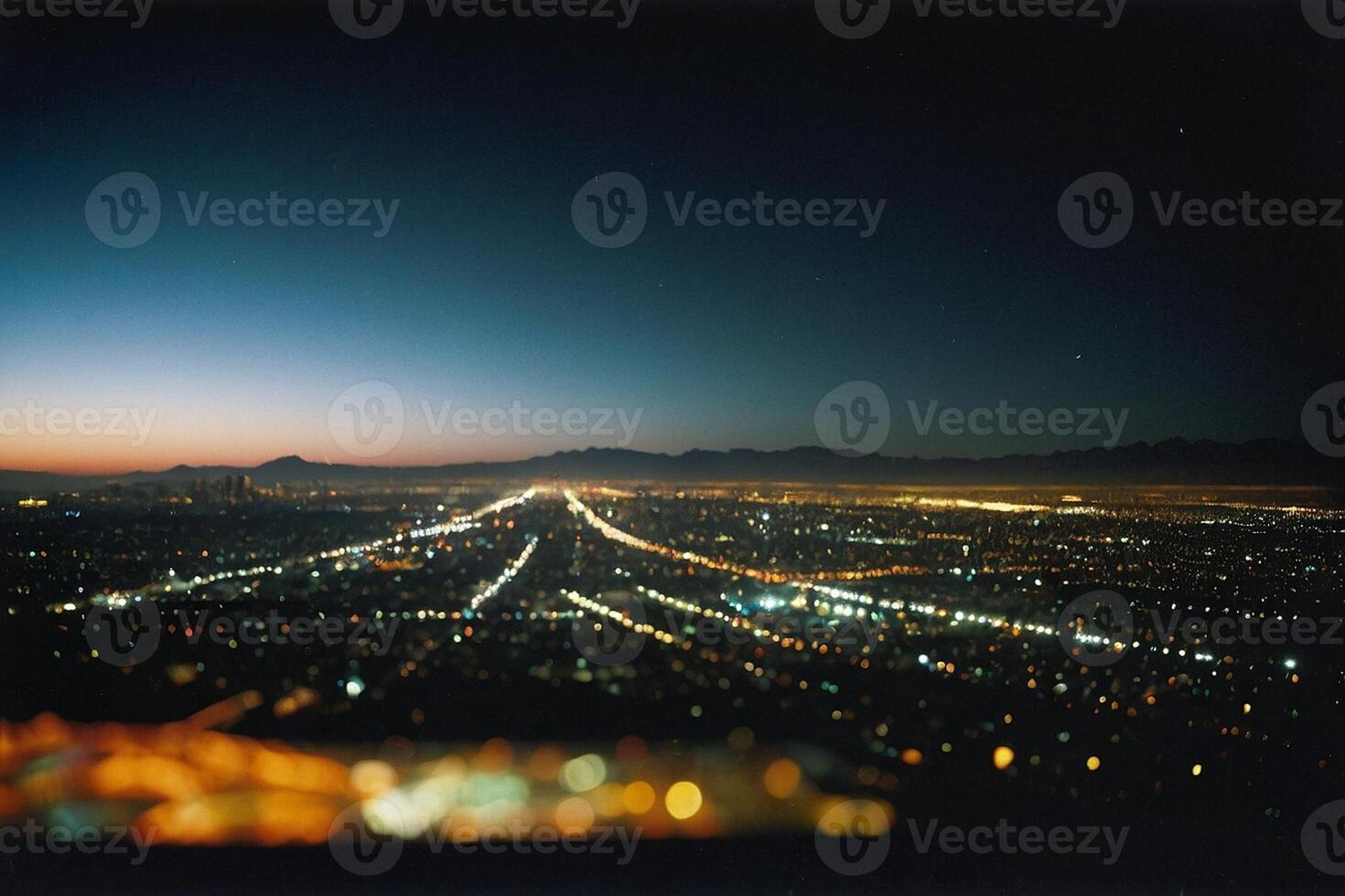 a view of the city at night from a high vantage point photo