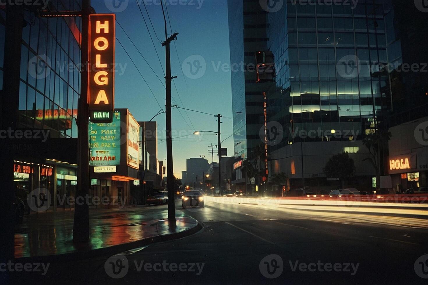 a car drives down a city street with palm trees photo