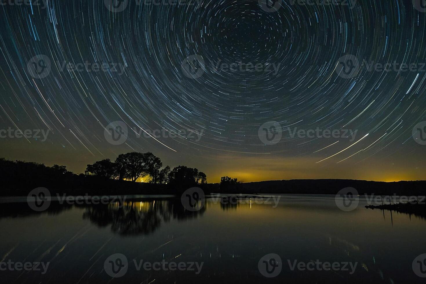 star trails over a lake and trees photo