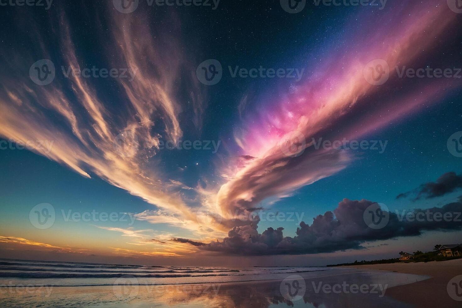 a rainbow is seen over the ocean at night photo