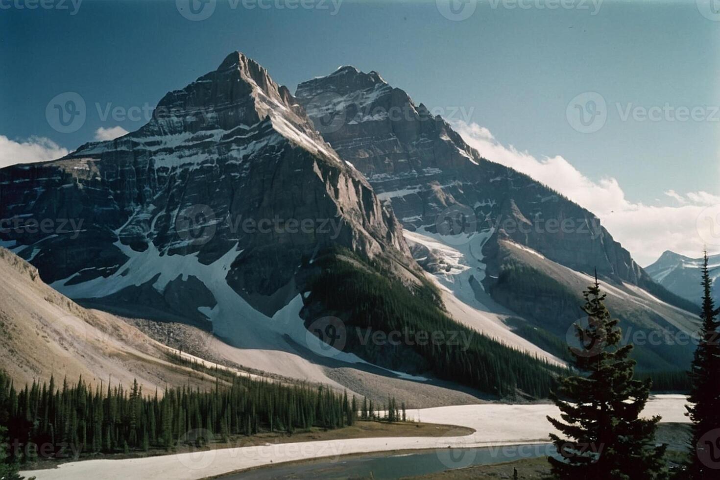 a mountain range with trees and mountains in the background photo