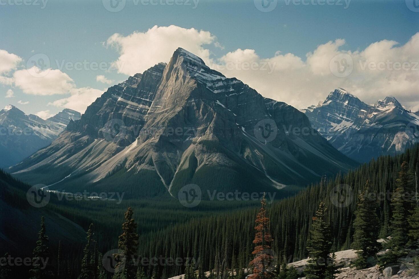 a mountain range with trees and mountains in the background photo