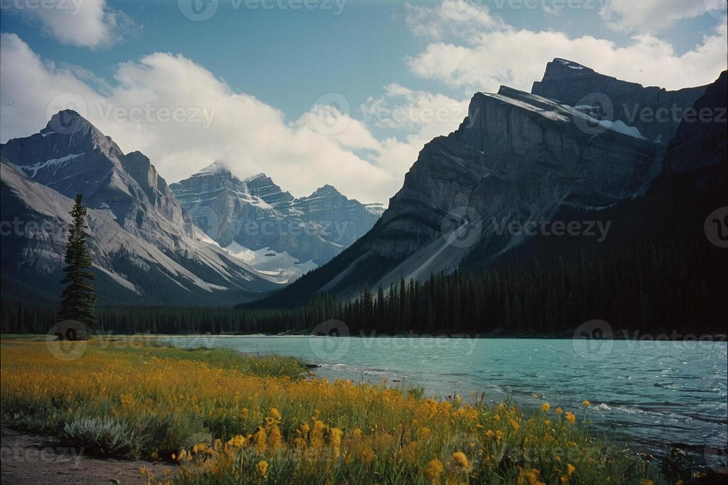 a river runs through a valley surrounded by mountains photo