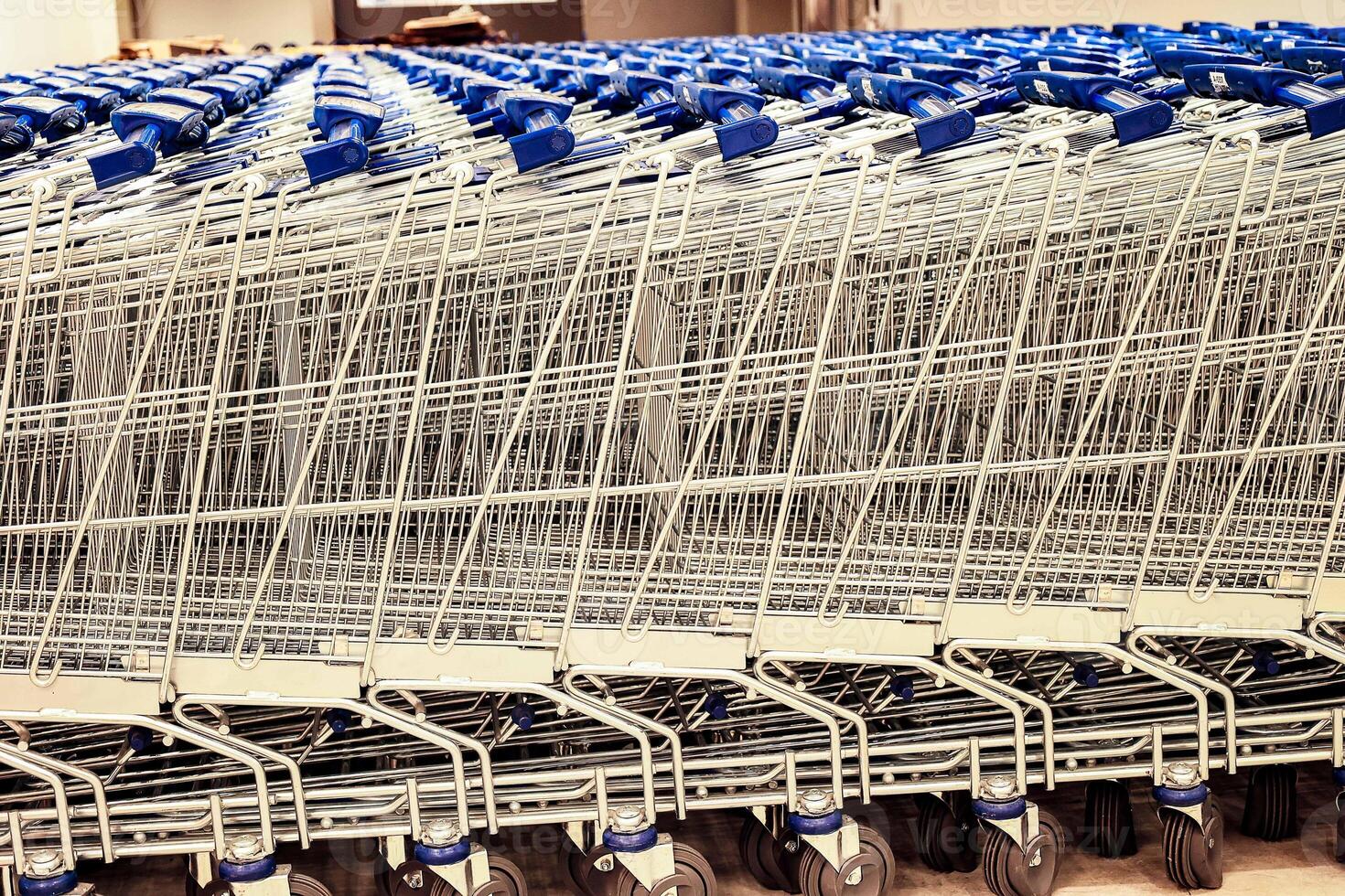 Empty Supermarket Trolley with Blue Handle photo