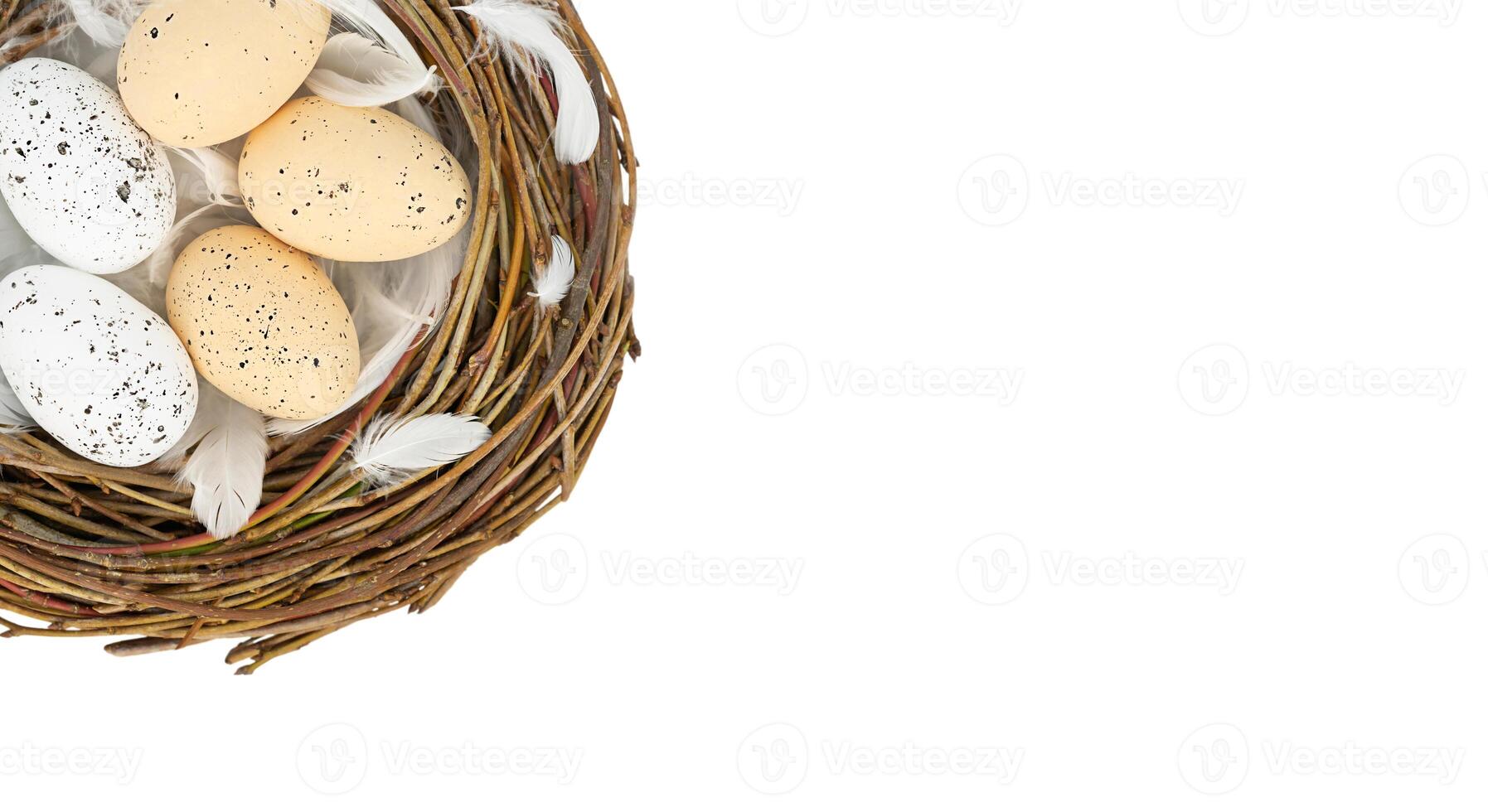 Easter background - bird's nest with eggs isolated on white, top view photo