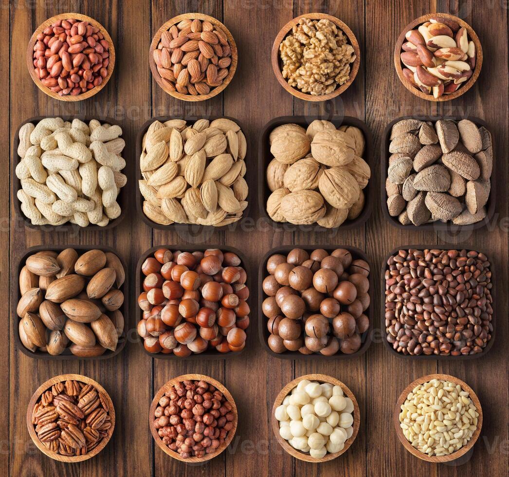 mix nuts bowls on table background. nutritious organic food for snack. photo